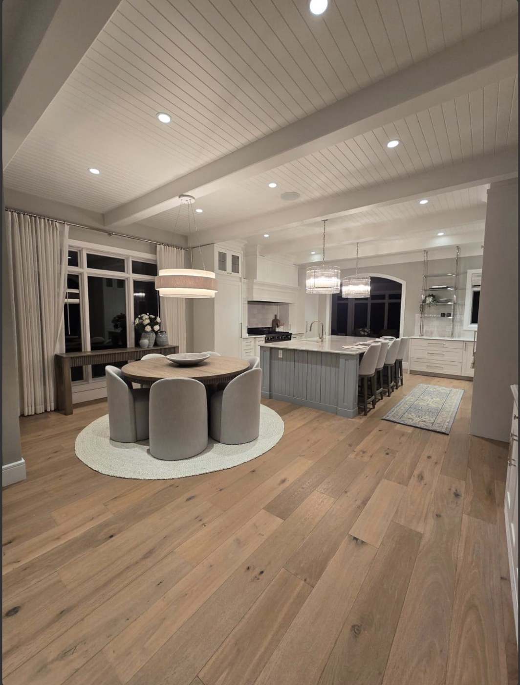 Bright kitchen and dining area with clean wood floors